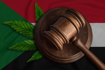 Judges gavel and cannabis leaf on the Sudan flag background. Cannabis legalization concept