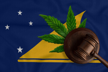 A gavel on the background of the flag of the State of Tokelaujuana legalization concept. Tokelau...