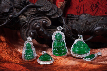 Imperial green jadeite jade Guan Yin (Avalokitesvara), Smiling Buddha and four season peas pendant....