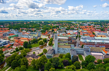Fototapeta na wymiar Vasteras, Sweden. City Hall. Panorama of the city in summer in cloudy weather. Aerial view
