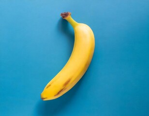 A single pic banana on blue background top view