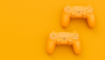 Video game joysticks or gamepads in plain monochrome yellow color background © Vasyl Onyskiv