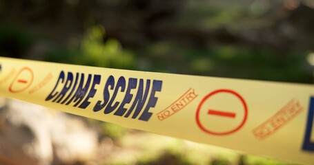 Police, yellow line or crime scene in outdoor for emergency, homicide or restricted area for...