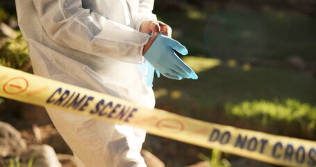 Forensic, gloves and police tape at crime scene for investigation, getting ready and hazmat for...