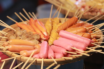 Street Food Asia: Women choose food at a night market. High quality 4K slow motion foodie concept...