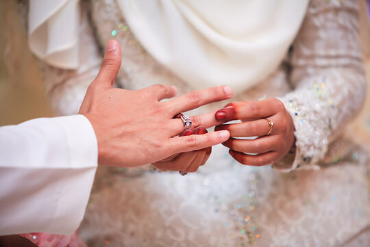 Malay marriage, malay wedding ceremony, exchange of rings close-up. Selective focus.