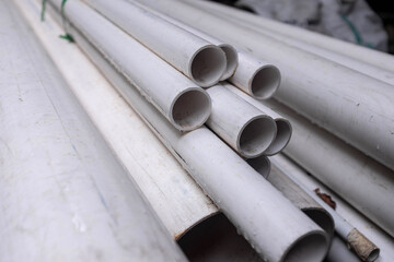 White PVC pipes ready to be installed to a new construction project