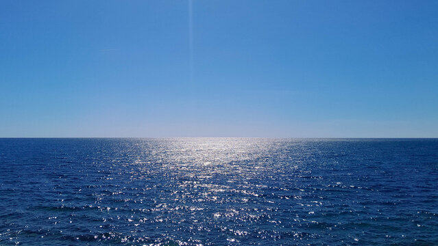 Blue sea and blue sky. Calm sea on a sunny day.