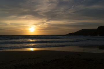 Stunning sunset over sea in Golden Bay Malta.