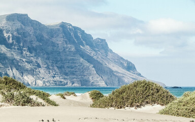 Beach and mountains - beautiful coast in Caleta de Famara, Lanzarote Canary Islands.