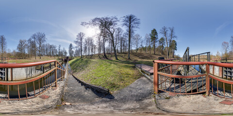 hdri 360 panorama near gateway lock construction on river, canal for passing vessels at different water levels. Full spherical 360 degrees seamless panorama in equirectangular projection - obrazy, fototapety, plakaty