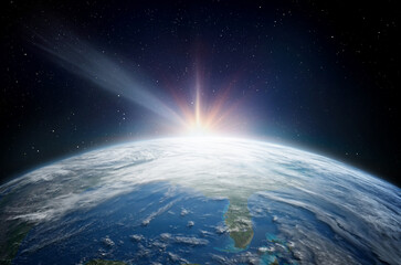 Comet, asteroid, meteorite flying to the planet Earth.  Glowing asteroid and tail of a falling...