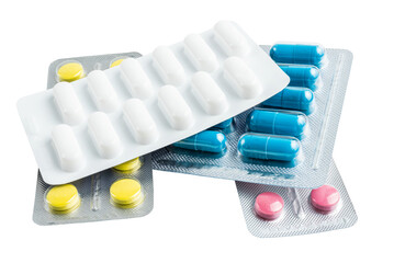 Various medicine capsules, pills and tablets in a blister pack isolated on white background,...