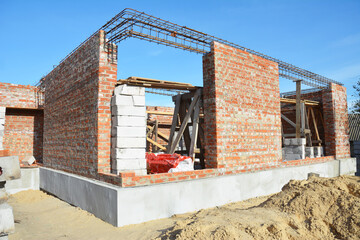 New brick house construction with rebar steel bars, reinforcement concrete bars with wire rod as a lintel for windows and seismic resistant.