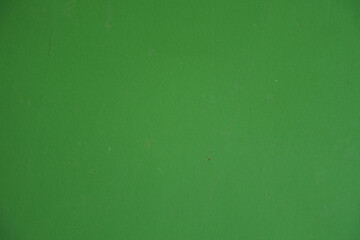 Surface of bright forest green painted wall
