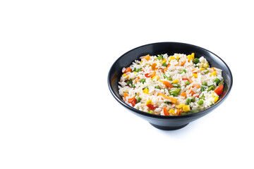 White rice with vegetables in a black bowl isolated on white background. Copy space