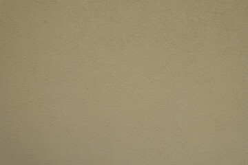Background - wall with coarse light beige roughcast finish