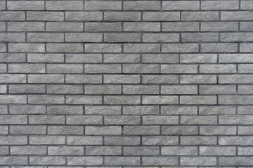 Backdrop - gray artificially aged brick veneer wall