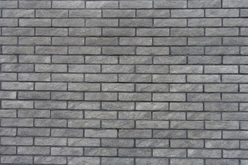 Background - gray artificially aged brick veneer wall