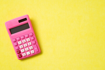 pink calculator on the table for business concept