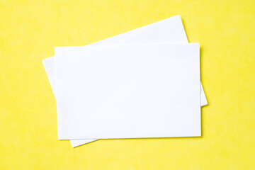 white paper sheets isolated on yellow background