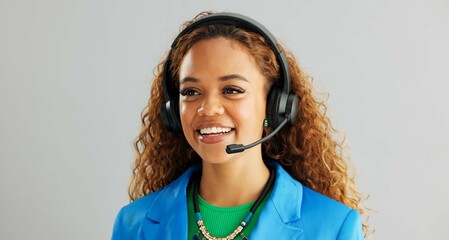 Happy woman, consultant and talking with headphones for customer service or call center on a gray...