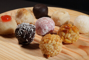 Panellets, typical sweets from Catalonia with almonds, chocolate, pine nuts, coconut zest and potato