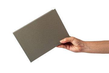 Blank grey book cover in hand on transparent background.