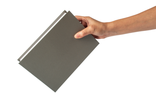 Blank grey book cover in hand on transparent background.