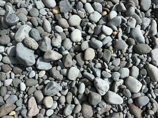 Gray color pebbles on a wild beach in El Medano, Tenerife, Canary Islands, Spain