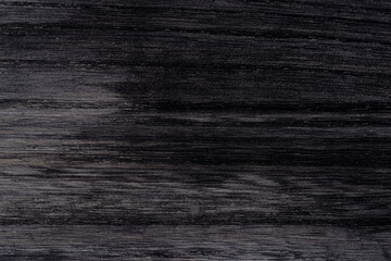 黒に塗装された木の板の表面