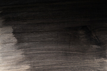 黒に塗装された木の板の表面