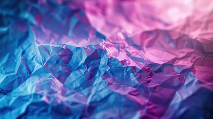 A colorful abstract background of crumpled paper in shades of blue and pink