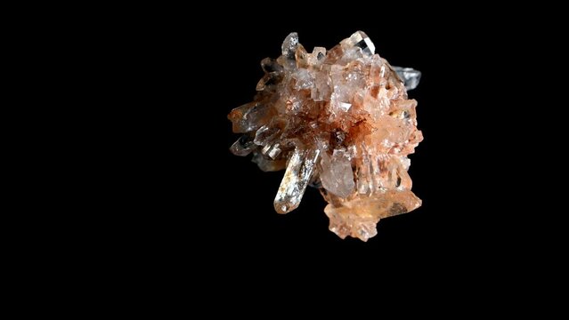 Creedite (calcium aluminium sulfate fluoro hydroxide) crystals sample from Mexico, rotating slowly against a black background.