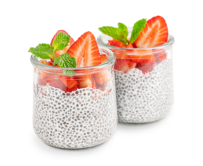 Homemade sweet vegetarian chia pudding healthy dessert made with seeds soaked in alternative milk decorated with sliced juicy strawberry topping and fresh mint leaf in glass jar isolated on white