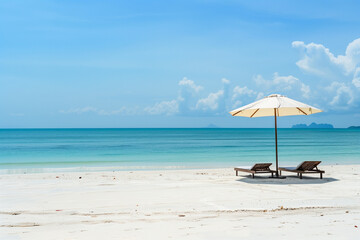 white sand beach with umbrellas and sun beds - 775796510