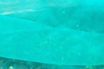 green nylon net with drop of water