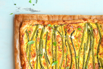 Asparagus pie or tart with eggs, cheese and aromatic herbs, spring Easter recipes. French healthy cuisine, Provencal herbs. Spring asparagus - 775804334