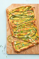 Asparagus pie or tart with eggs, cheese and aromatic herbs, spring Easter recipes. French healthy cuisine, Provencal herbs. Spring asparagus - 775804344