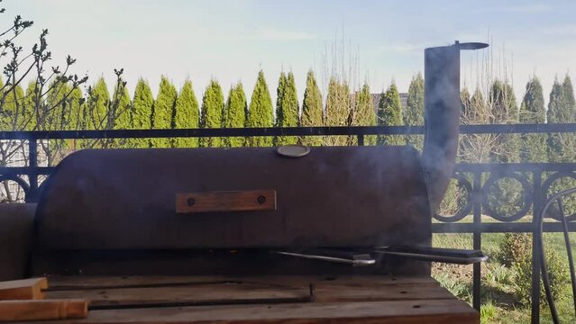 A short clip of two trouts being barbecued using tradition charcoal grill