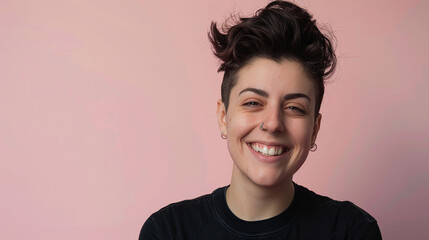 Androgynous woman with a punk style smiling against a solid color background - obrazy, fototapety, plakaty