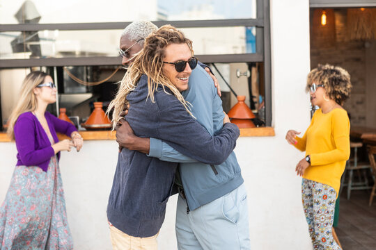 Diversity and camaraderie at a rooftop bar gathering