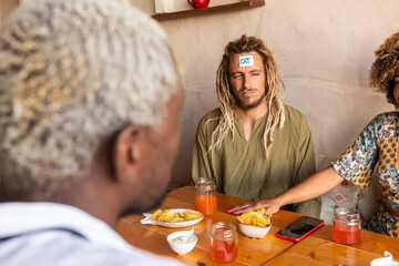 Friends playing guessing game at a casual bar