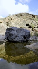 Large lava stone fallen into the ravine of the Canary Islands of volcanic origin