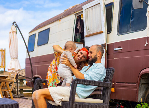 Family living in a van with homemade deck and garden