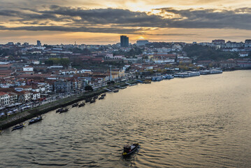Sunset over Vila Nova de Gaia city, view from Dom Luis I Bridge, Portugal