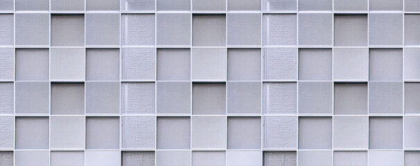 Geometric square pattern background of expanded aluminium grating wall decoration outside of modern...