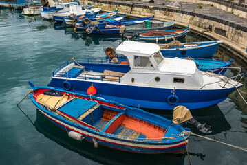Fishing boats in port of Syracuse city, Sicily, Italy