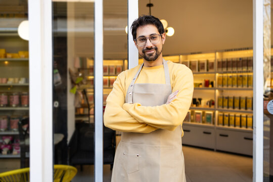 Smiling business owner at his boutique grocery shop