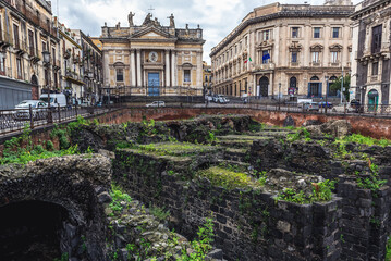 Ruins of Roman Amphitheater and San Biagio church at Stesicoro Square in historic part of Catania city, Sicily, Italy